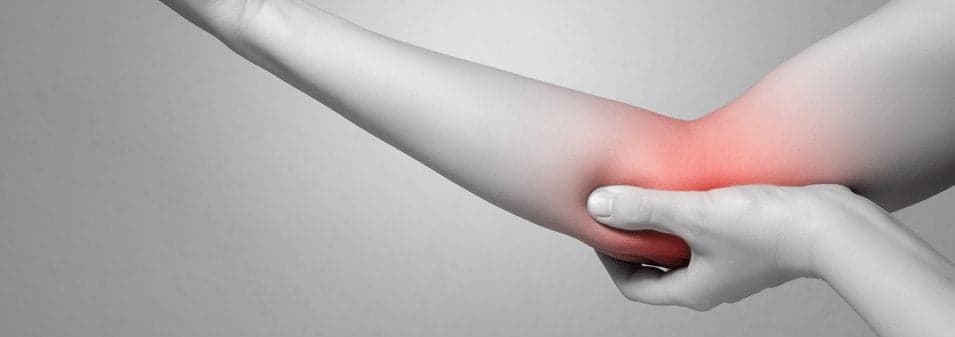 elbow pain illustrated by red color on greyed picture