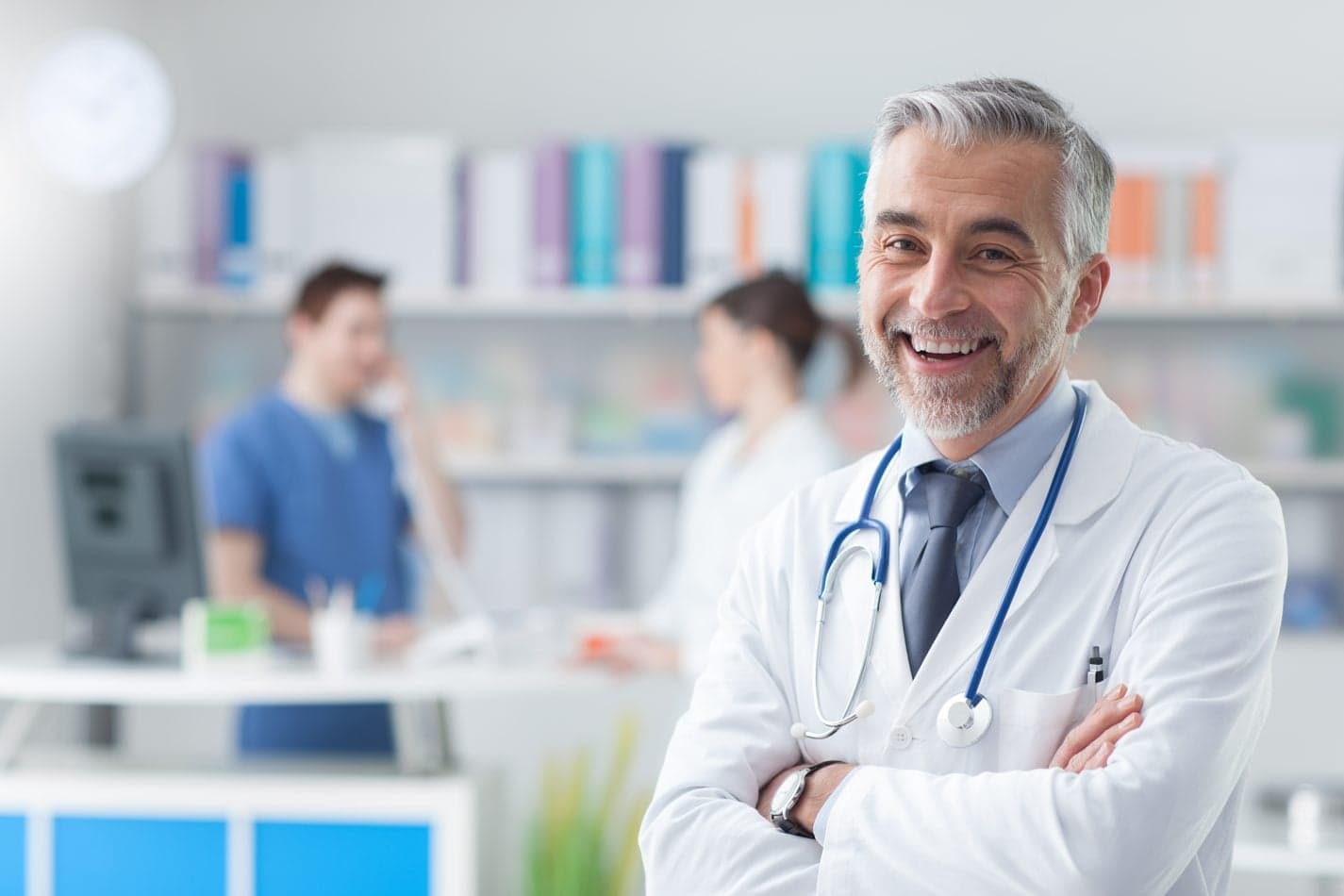 Picture of smiling doctor with blurred doctor