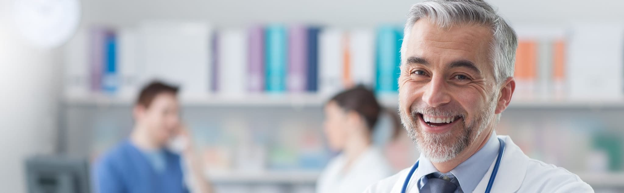 Picture of smiling doctor with blurred doctor