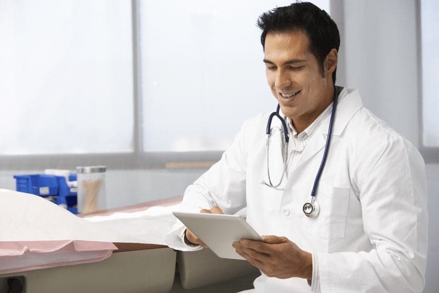 Picture of doctor looking at ipad