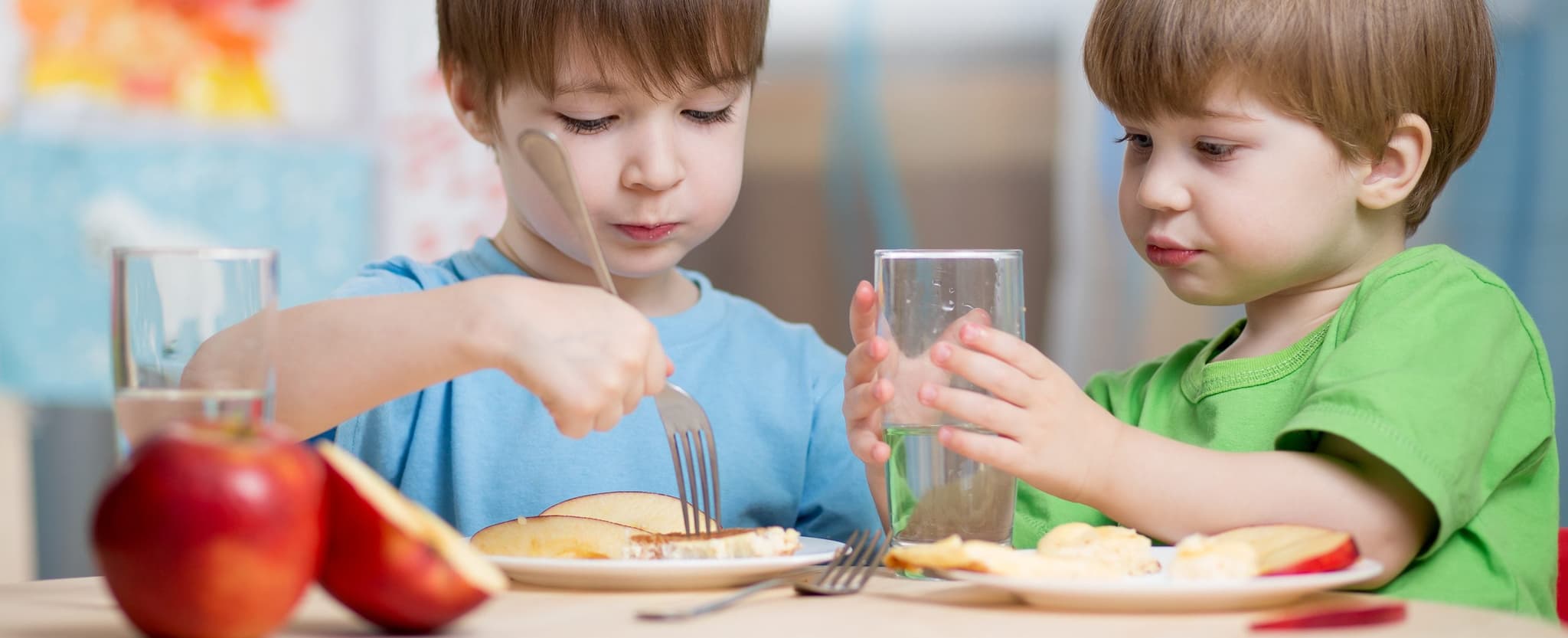 Picture of children eating apples and breakfast