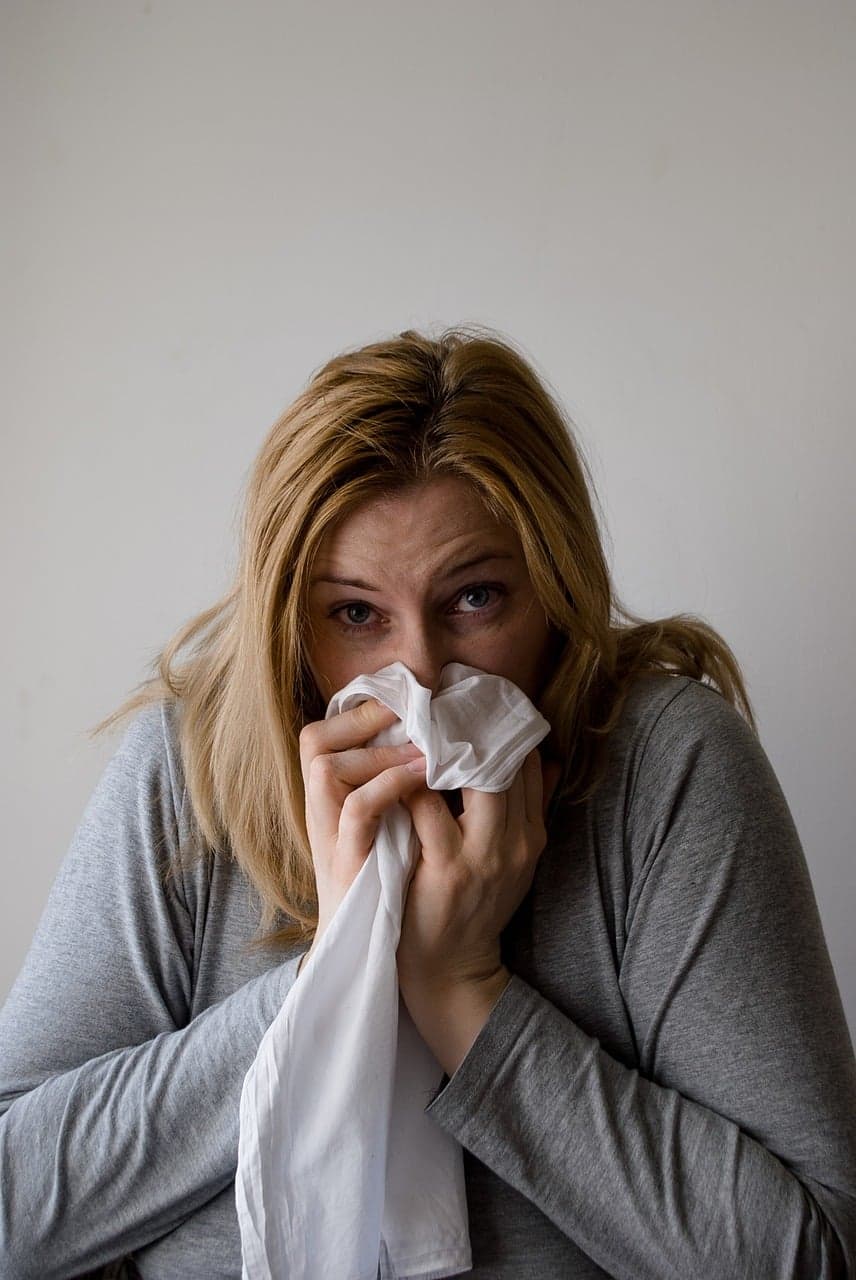 Picture of woman blowing her nose