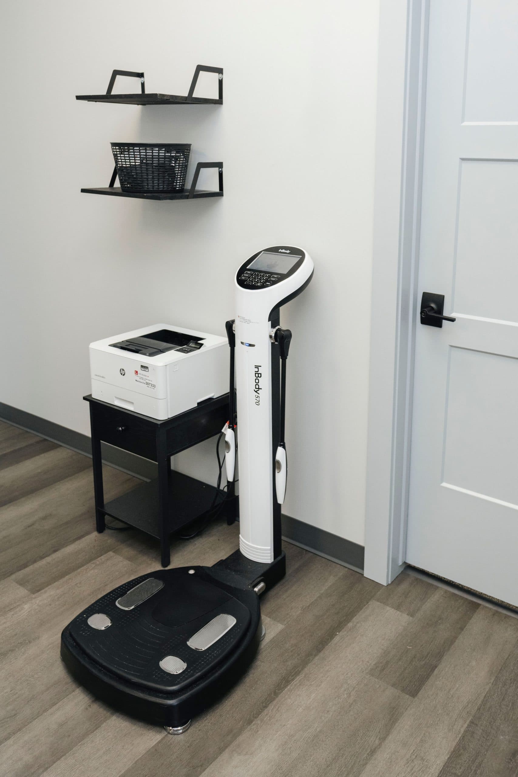 Body composition scale and height measurement tools for tracking progress in patient weight loss journeys.