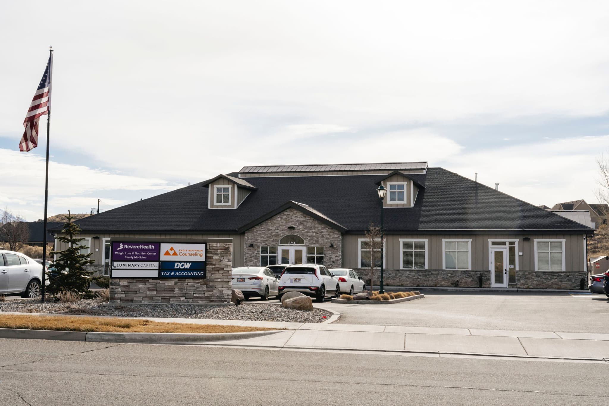 Main parking lot and entrance to the Revere Health Weight Loss & Nutrition Center with accessible patient drop-off area.