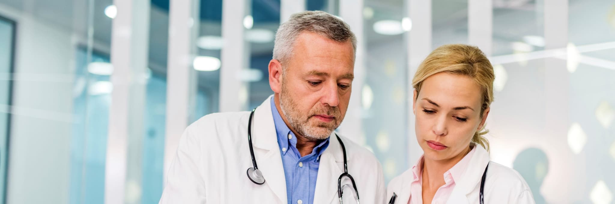 Picture of doctors looking at report