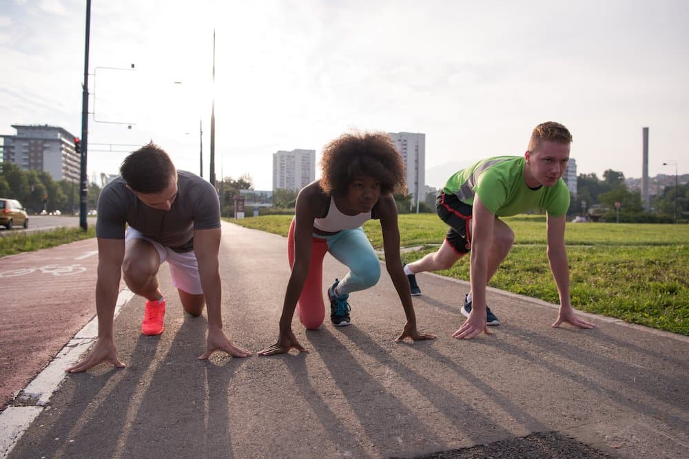 Picture of multiethnic group of young people on the jogging beautiful morning as the sun rises in the streets of the city